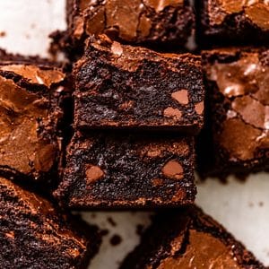 black cocoa brownies cut into squares and stacked on their side to see the fudgy centers.