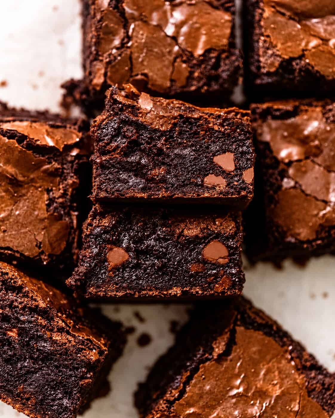 black cocoa brownies cut into squares and stacked on their side to see the fudgy centers.