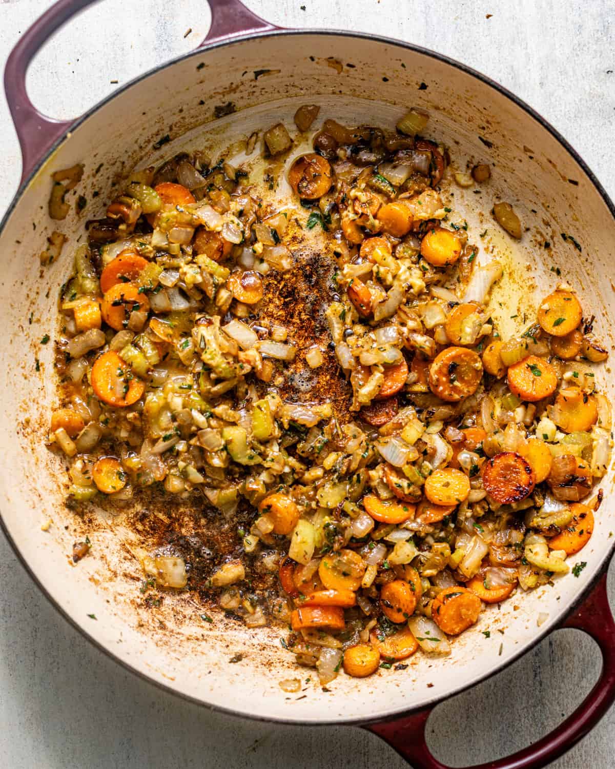 onion, carrots, celery, herbs, and butter cooked in a pan with seasonings and dijon mustard and chicken bouillon paste.